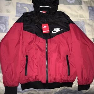 With tags Nike red and black wind breaker